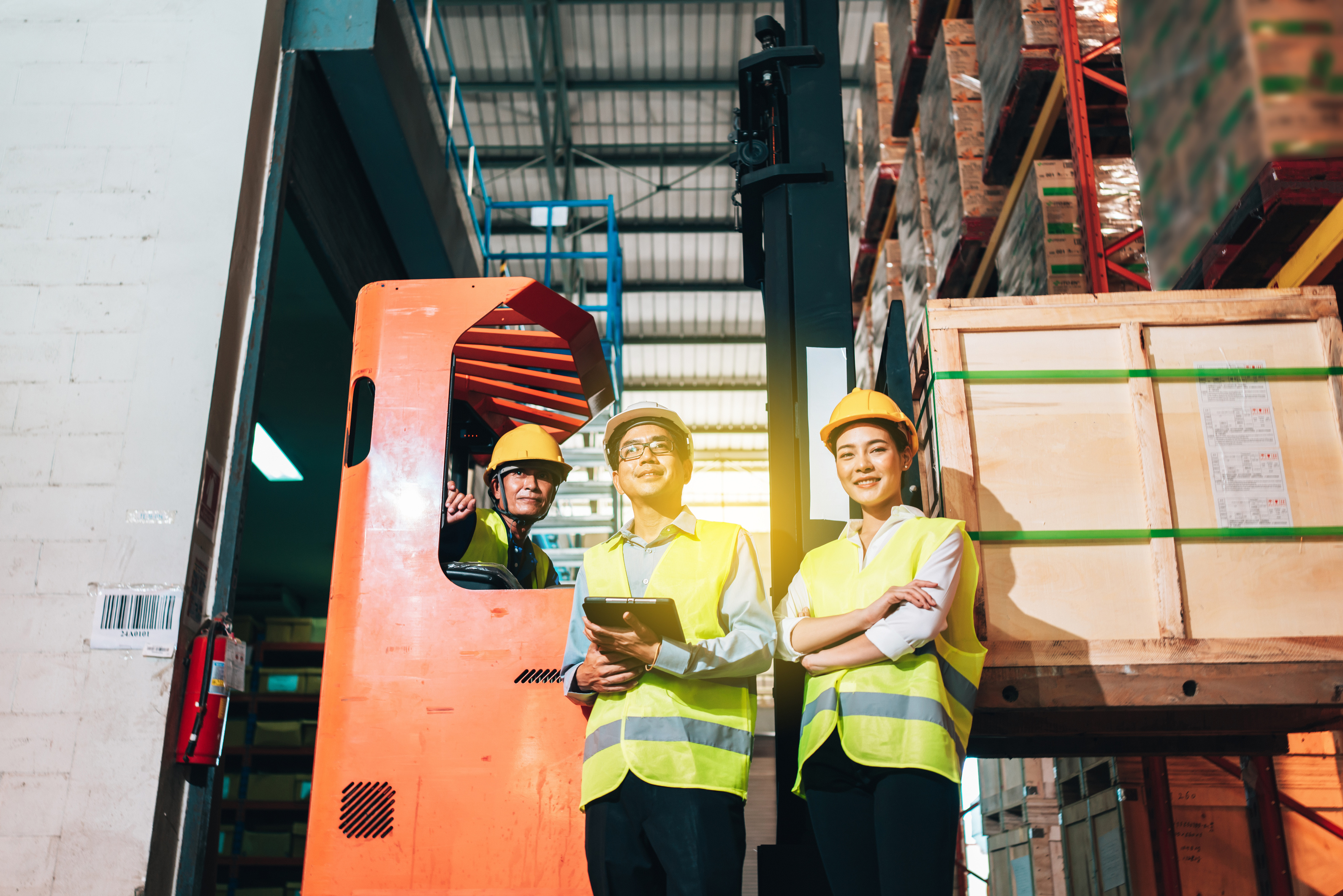 Warehouse Employees with Hardhats and Safety Vests